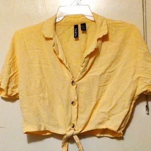 Large, yellow, crop top